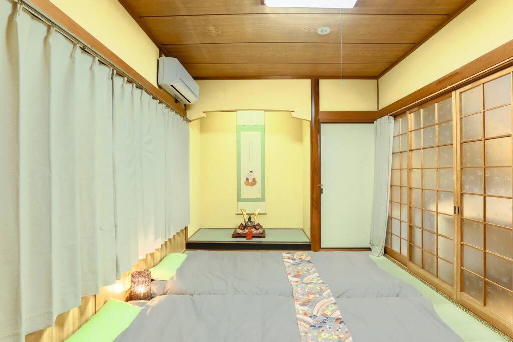 Holiday home 京都中心部【九色庵】嵐山直行　駅近　西院すぐ *